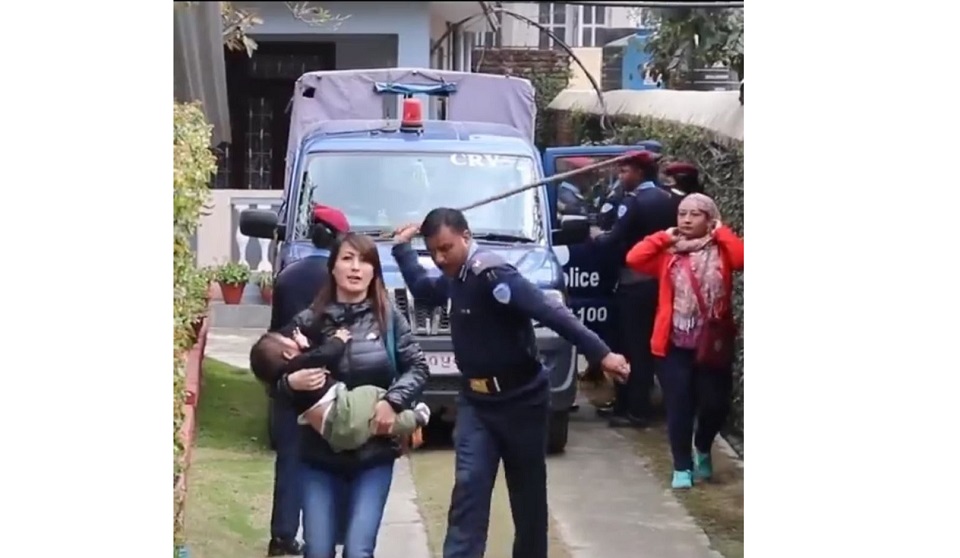 Policeman faces harsh criticism on social media for using force against mother carrying child