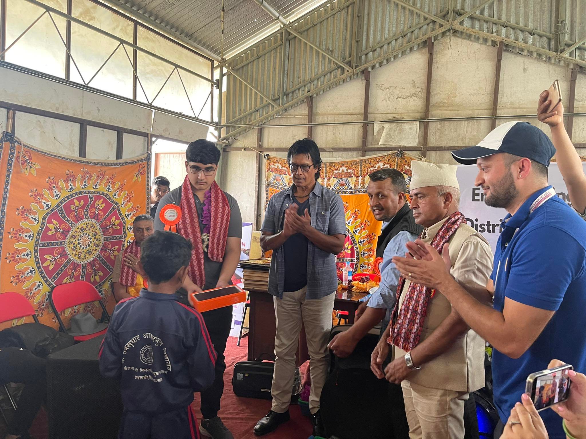 Rajesh Hamal distributes tablets to students of Jyamire