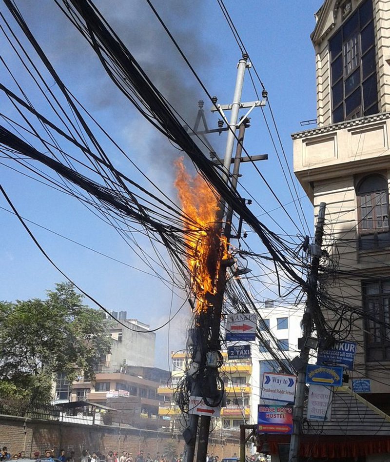 Electric pole catches fire, contained