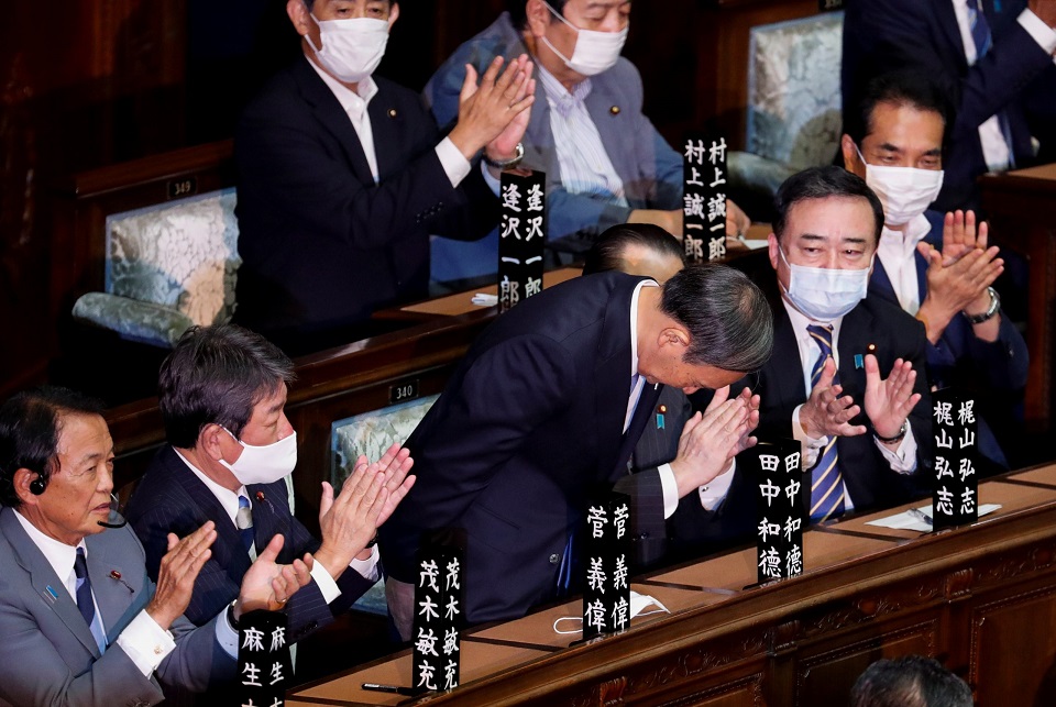 Japan's Suga formally voted in as PM, readies 'continuity cabinet'