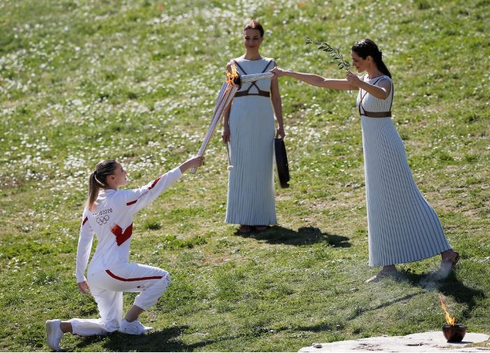 Tokyo 2020 torch lit behind closed doors in ancient Olympia