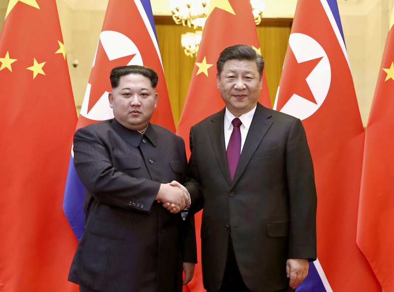 Kim, Xi portray strong ties after NKorea leader’s China trip