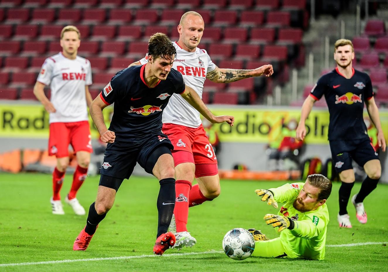 Soccer-Leipzig move into third spot with 4-2 win at Cologne