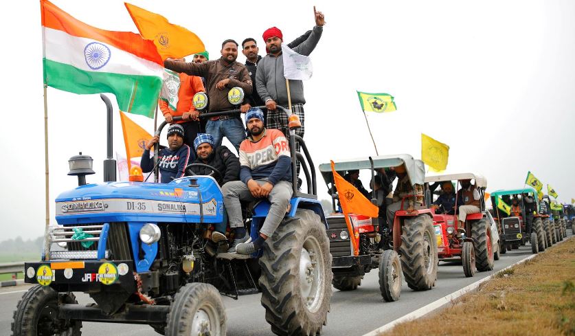 Indian farmers ride caravan of tractors into capital ahead of Republic Day