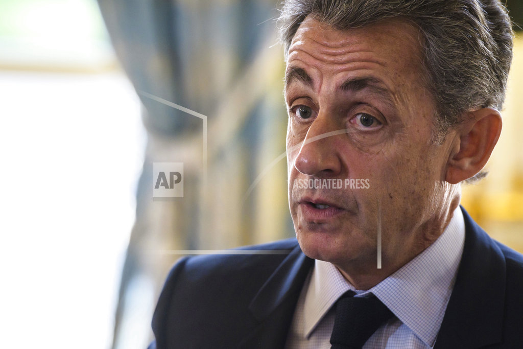 Ex-French president Sarkozy held on Gadhafi claims - source