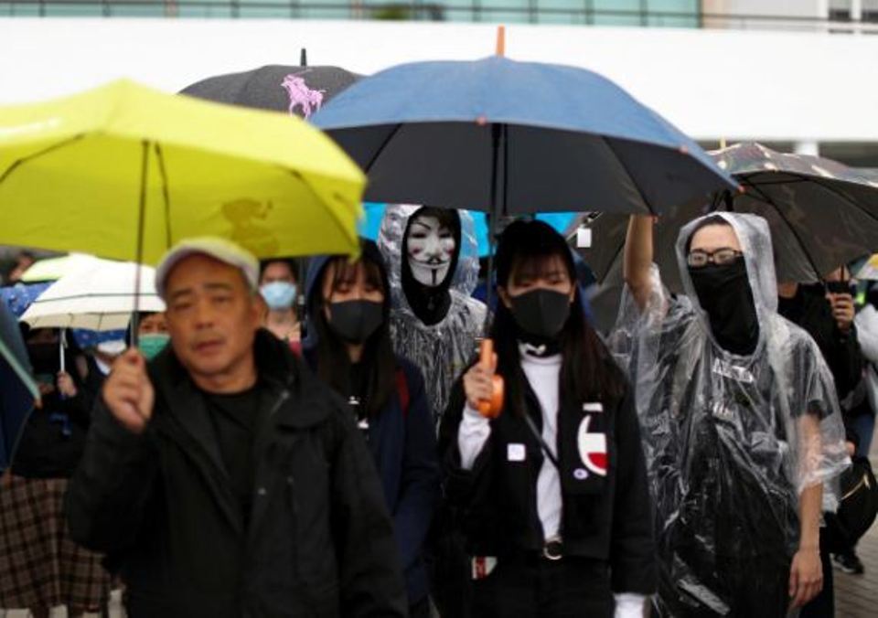 More than 1,000 gather for rain-soaked Hong Kong rally