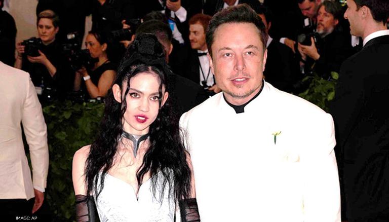 Elon Musk says he and musician girlfriend Grimes are 'semi-separated'