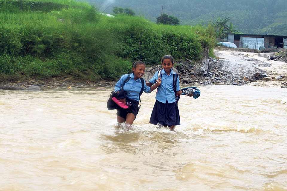 Children compelled to cross raging monsoon river to get to school