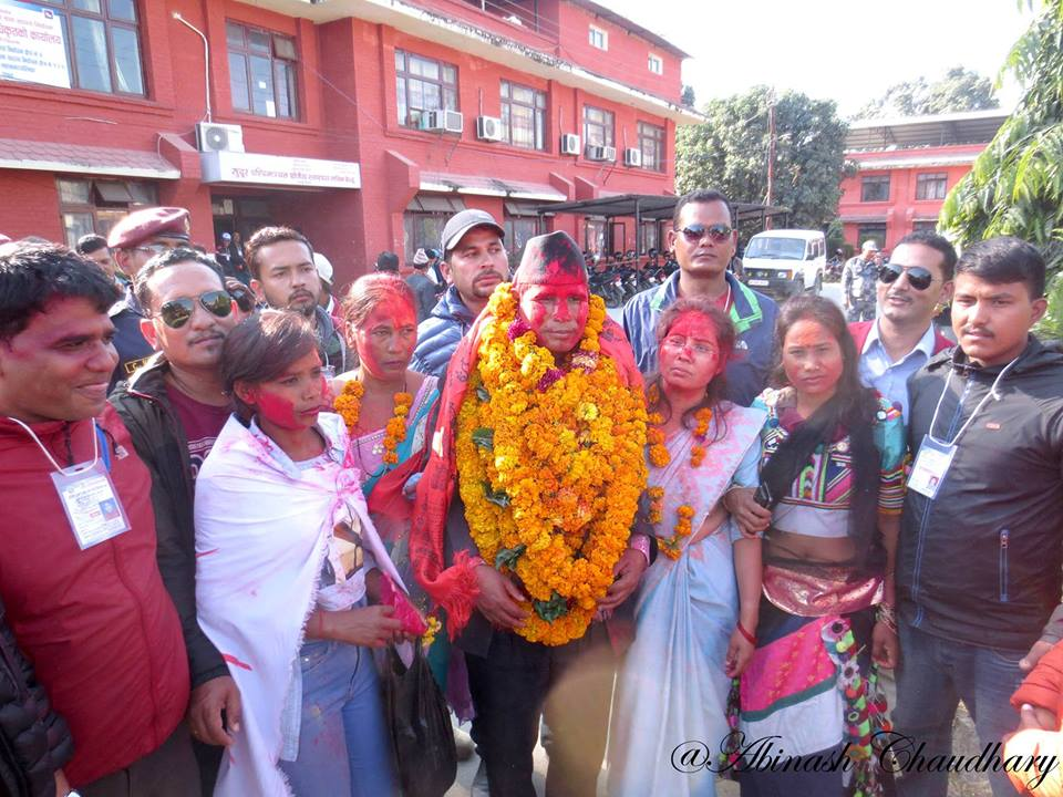 Flanked by wives, Narad Muni Rana celebrates victory