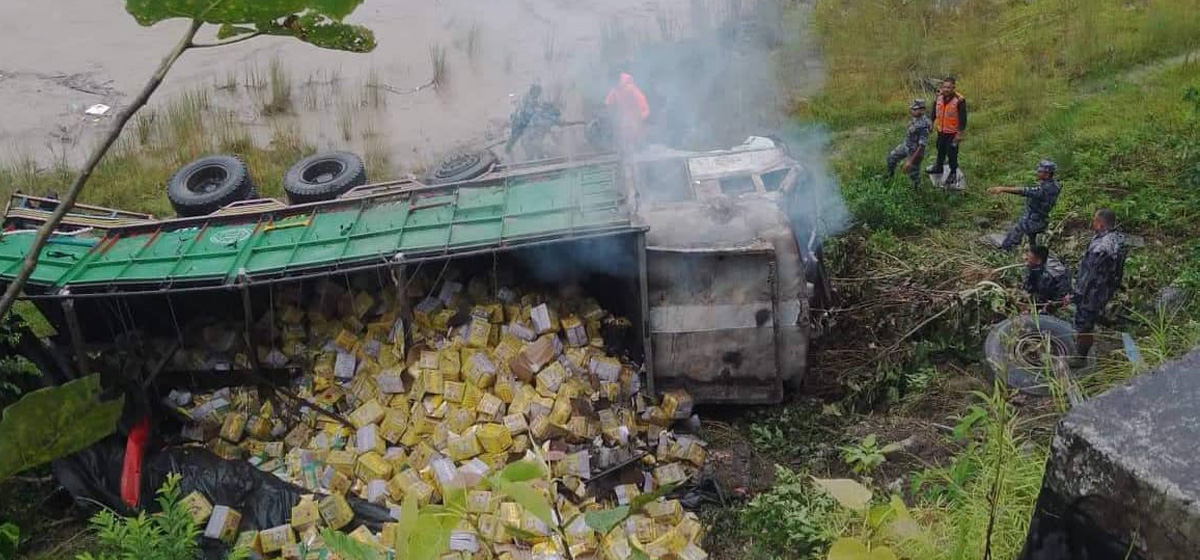 Truck carrying edible oil falls off the road in Dhading