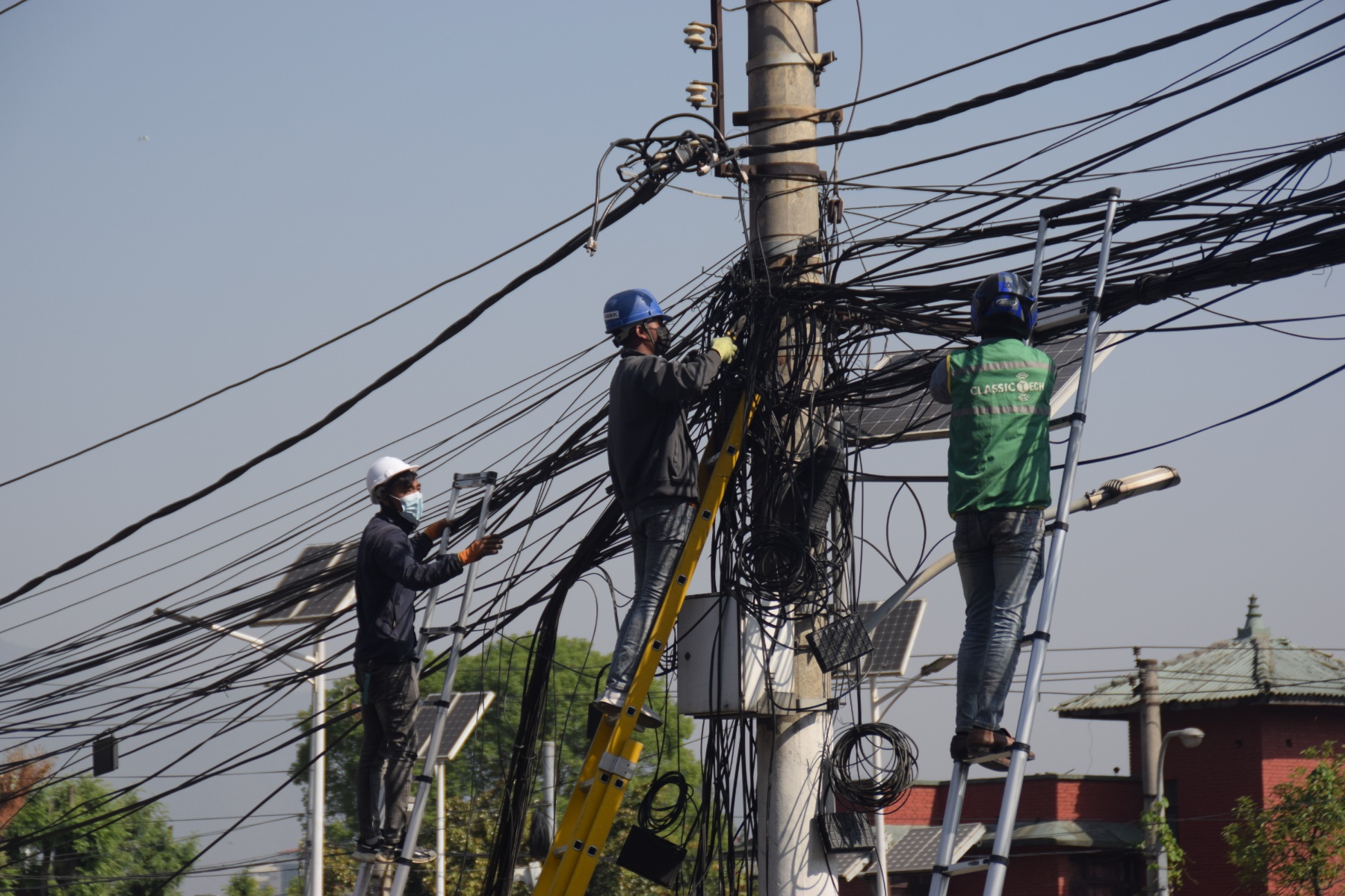 In Pictures: Kathmandu metropolis starts removing haphazardly placed internet, cable TV wire from city areas